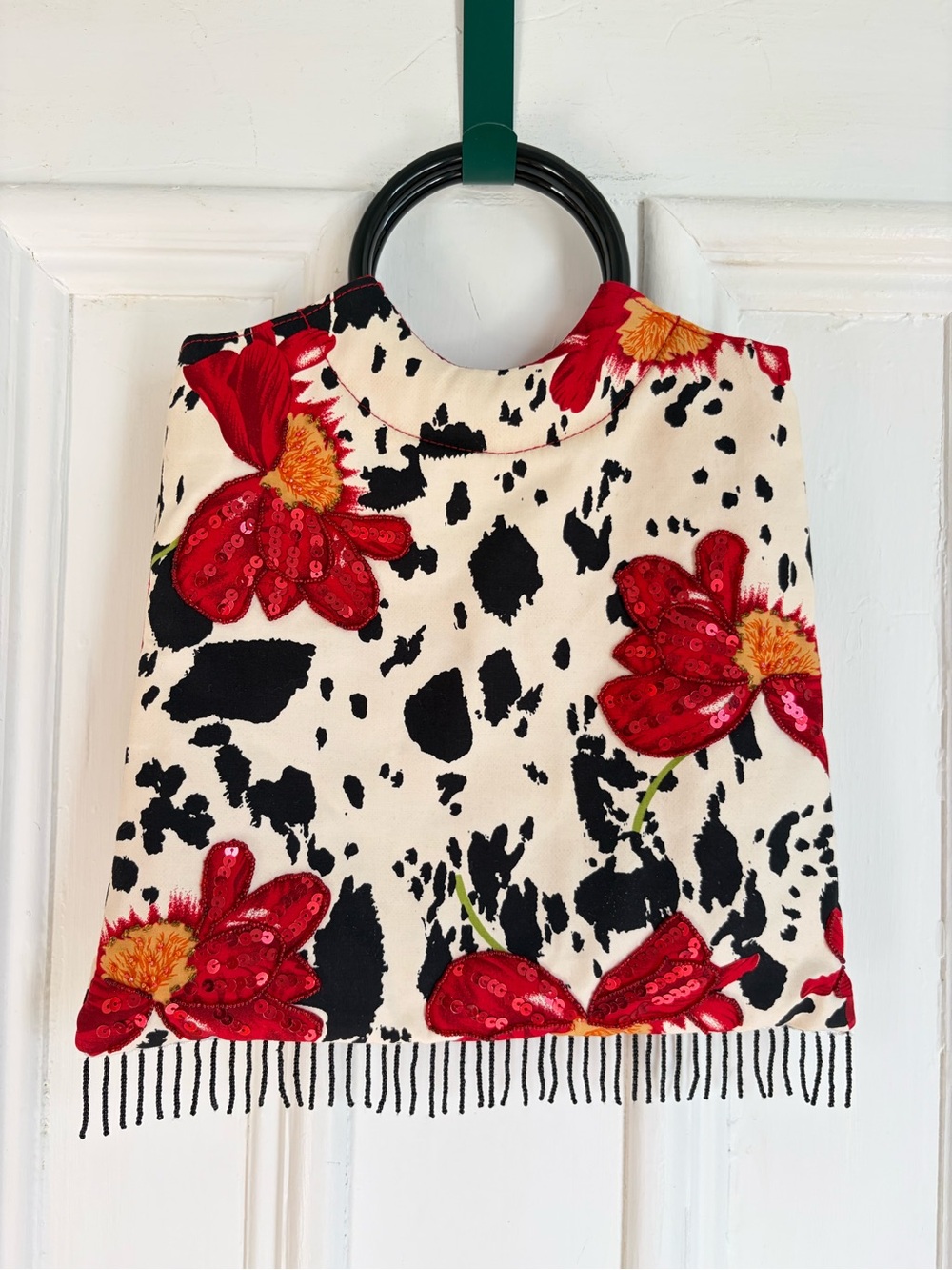 Cow Print Purse with Red Floral Sequin Pattern and Beaded Tassels